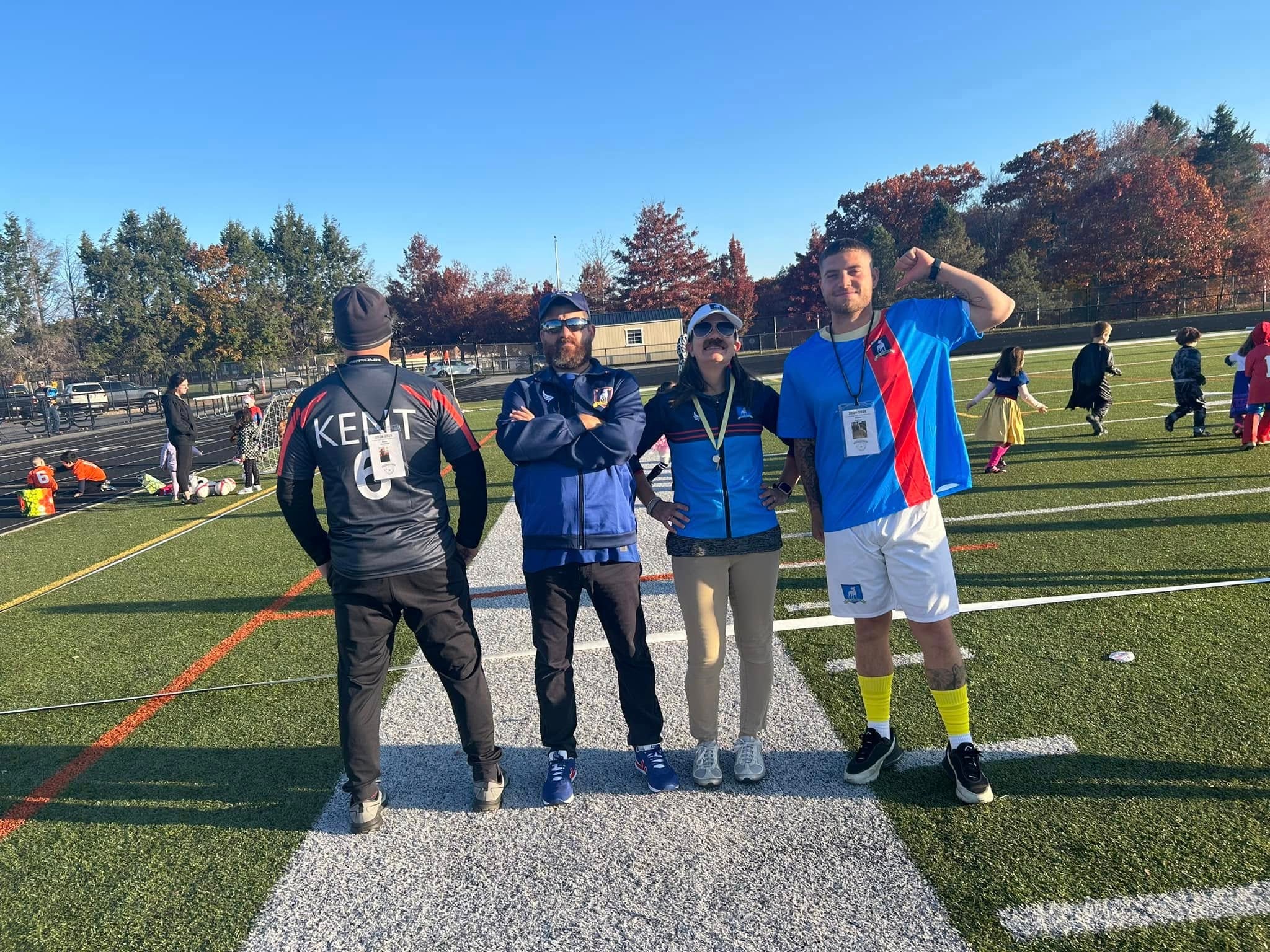 Coaches and referees at youth soccer event